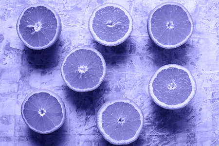Flat lay the raw fresh citrus fruit toned in Very Peri color - color of the year 2022の写真素材