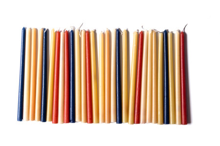 Festive composition with traditional Jewish candles for the Hanukkah holiday on a white background, top view. old rituals.の写真素材