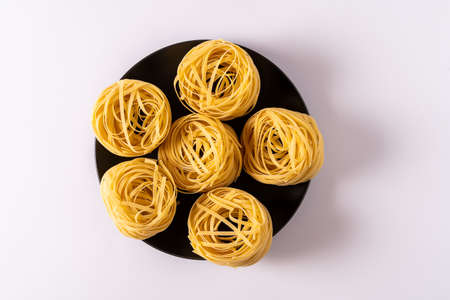 Pasta, spaghetti on a white background top view ,flat lay with copy space.の写真素材