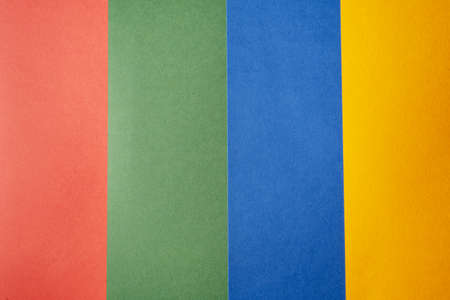 Abstract background with colored paper texture. Minimal composition on paper in red, yellow, green...