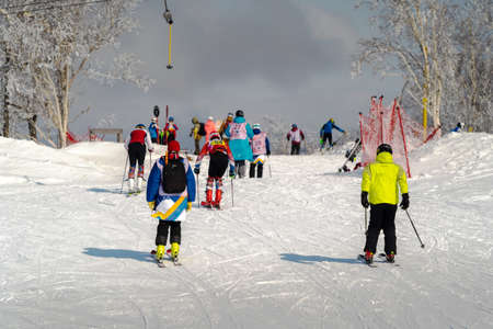 March 14, 2022, Mountain Air, Yuzhno-Sakhalinsk, Russia : skiers in the slopes of the skiing resort.のeditorial素材