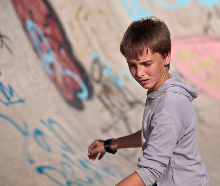 Boy rides his skateboard .Half-length portrait. Focus on the boy's face.の写真素材