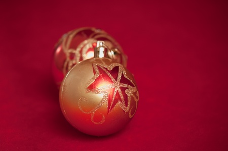 Varicoloured christmas balls on red  background  .の写真素材