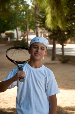Young boy with tennis racket .の写真素材