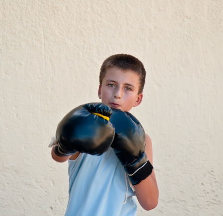 The boy in boxing gloves .の写真素材