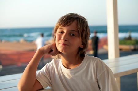 Portrait of a boy in the outdoor cafes.の写真素材