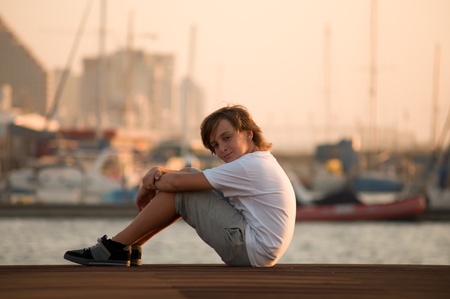 Portrait of a boy on the docks at the yacht club in Tel Aviv.