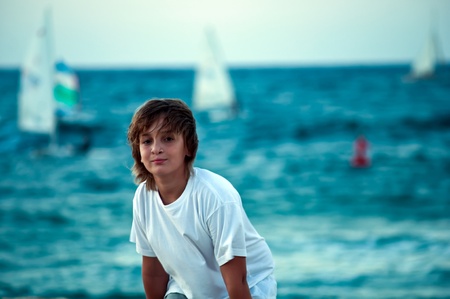 Portrait of a boy on the docks at the yacht club in Tel Aviv.の写真素材