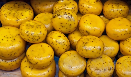 Cheese rounds - or wheels at a Market .の写真素材