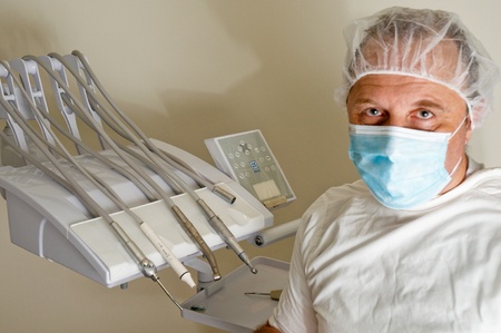 Doctor wearing a face mask on   white background .の写真素材