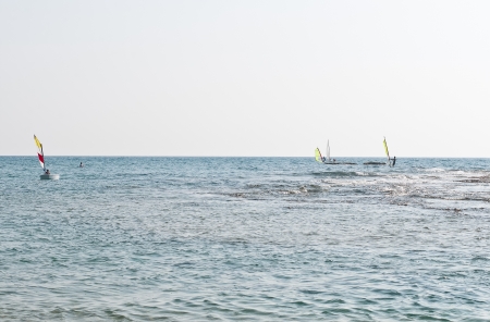 Windsurfers on strong wind and waves  の写真素材