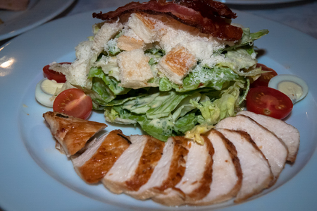 Cold appetizer with turkey fillet, bacon, tomatoes and lettuce .の写真素材