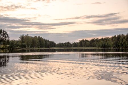 Panorama of lake at sunset with reflection in Finland .の写真素材