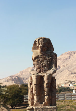Partly damaged ancient Egyptian statue of the Pharaoh Amenhotep III. The Colossi of Memnon.の写真素材