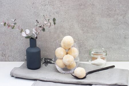 Homemade white chocolate, coconut and vanilla candy-truffles in the glass bowlの写真素材