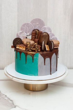 Delicious two-sided homemade birthday cake made in green and gray colors. Celebrating two birthdays...