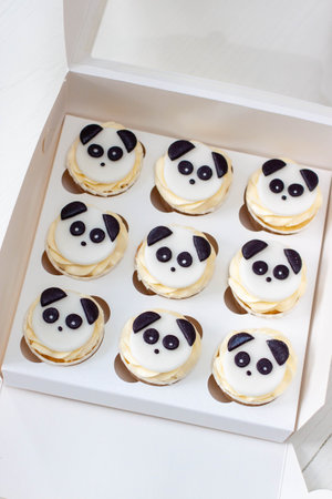 Black and white Panda cupcakes in gift box for children's birthdayの写真素材