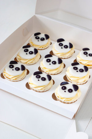 Black and white Panda cupcakes in gift box for children's birthdayの写真素材