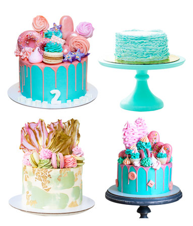 Assorted green cakes isolated on white background. Cakes with edible flowers, meringues, macarons, fondant ruffles, popsicles and melted chocolateの写真素材