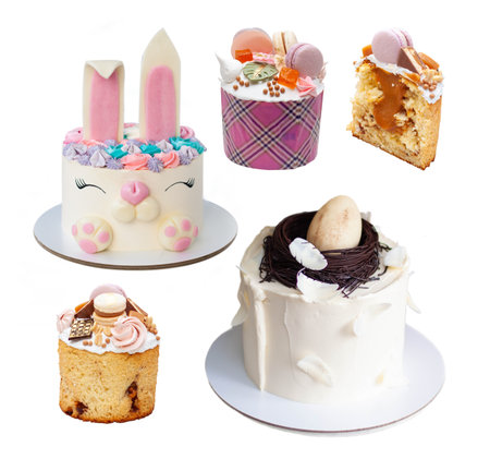 Assorted beautiful Orthodox Easter bread called Kulich, Bunny cake and Easter Egg cake isolated on...