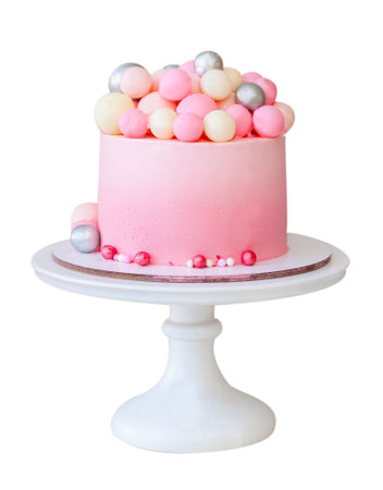 Tender gradient pink cake decorated with chocolate balls, gingerbread cookie with girl and bunny....