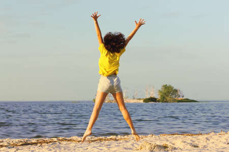Young girl in a jump of delight. Freedom and delight. Life after quarantine.