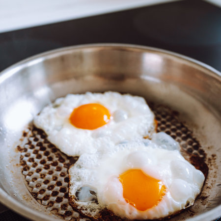 Fried eggs in a frying pan.の写真素材