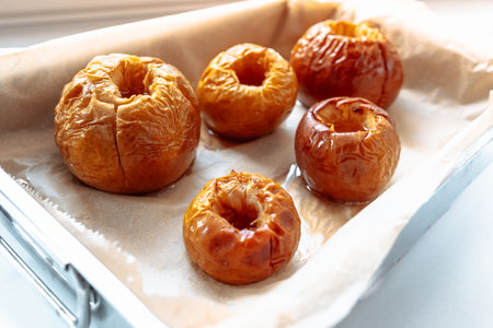 Baked apples in sugar syrupの写真素材