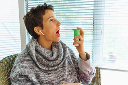 Ill lady spraying sore throat