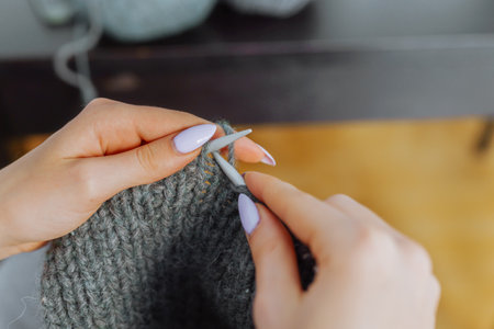 young woman knits wool productの写真素材