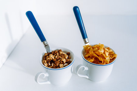 breakfast yogurt with cereal flakes in cupの写真素材