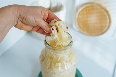 homemade sauerkraut in glass jarの写真素材