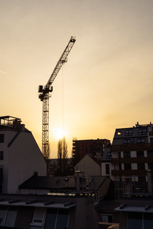 construction crane silhouette sunset new buildingsの写真素材