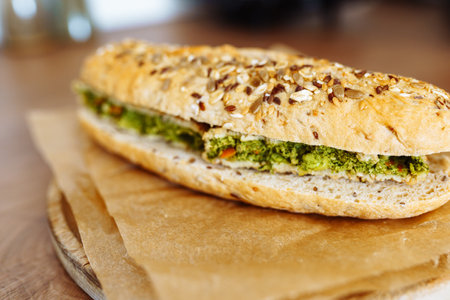 sandwich on whole grain bun with vegetable pattyの写真素材