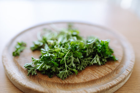 dried parsley on wooden round boardの写真素材