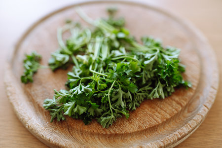 dried parsley on wooden round boardの写真素材