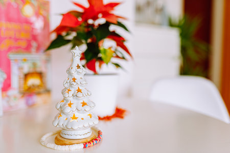 christmas decor candlestick tree flower christmas star on table in roomの写真素材