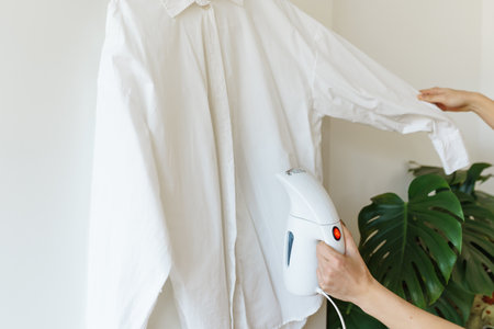 iron things with steam iron, steamerの写真素材