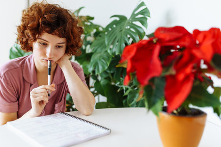 homeschooling, woman writing notes in notebookの写真素材