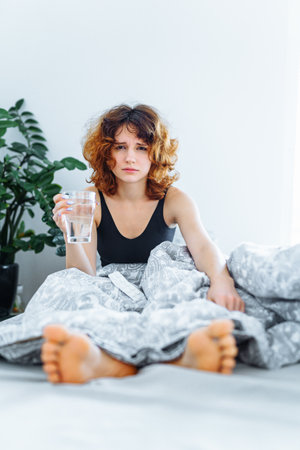 morning headache woman hangoverの写真素材