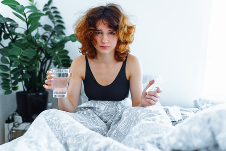 morning headache woman hangoverの写真素材