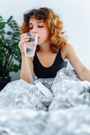morning headache woman hangoverの写真素材