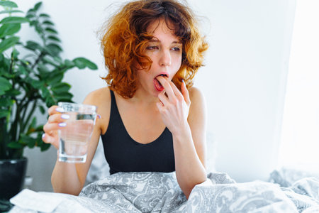 morning headache woman hangoverの写真素材