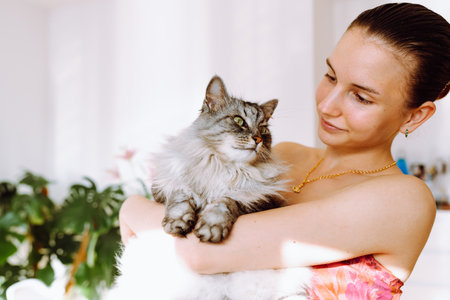 Portrait young woman with pet catの写真素材