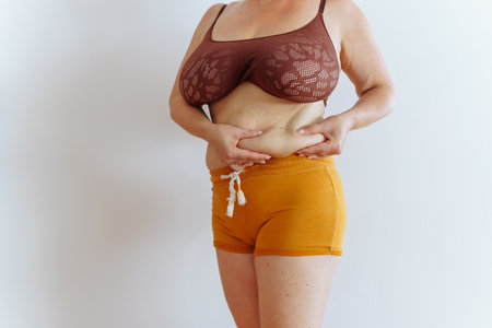 unrecognizable woman showing bellyの写真素材