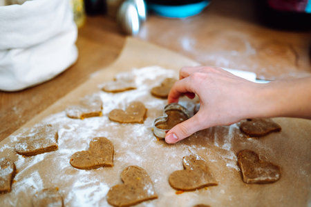 making heart-shaped gingerbread cookiesの写真素材