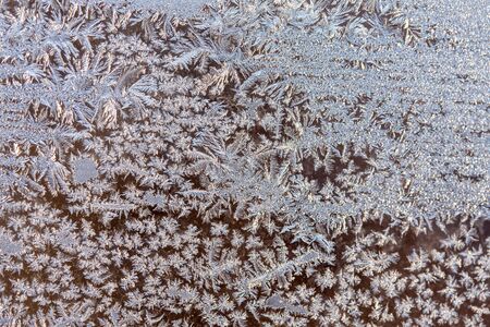 Frosty patterns on window glass.