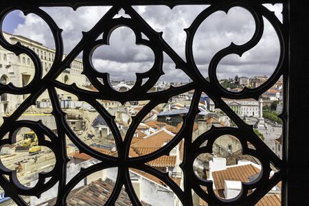 Top view of Lisbon through a forged grate. Lisbon, Portugal.