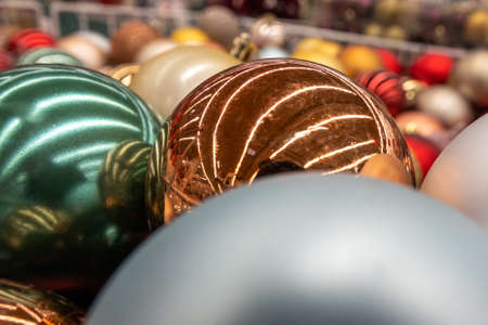 Multicolored Christmas balls close-up, as a New Year's festive background. Close-up, selective focus.の写真素材