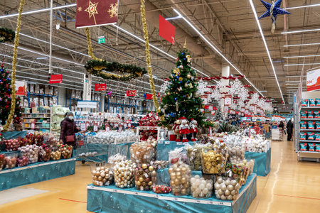 Moscow, Russia - November 20, 2020: Shopping malls have a New Year sale. Decorated Christmas trees are installed in the halls.のeditorial素材